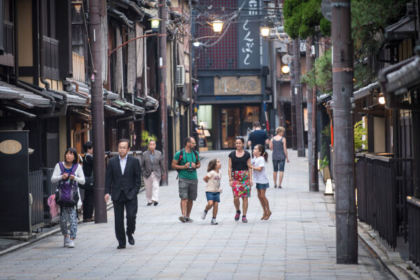 Family walking down a street in Kyoto
